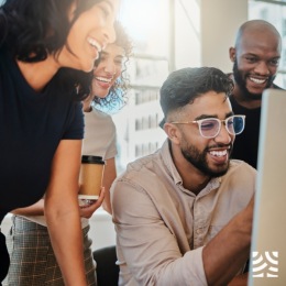 Aventon Annapolis Instagram post of a group of friends smiling at a computer