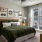 Annapolis MD Luxury Apartments with In-Unit Washer and Dryer - Aventon Annapolis - Bedroom with Carpet, Matching Night Stands, Bed with Bedframe, and Green Bedding.