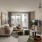 Luxury Apartments in Annapolis, MD with In-Unit Washer and Dryer - Aventon Annapolis - Living Room with Wood-Inspired Plank Flooring, Couch, Rug, and Coffee Table.